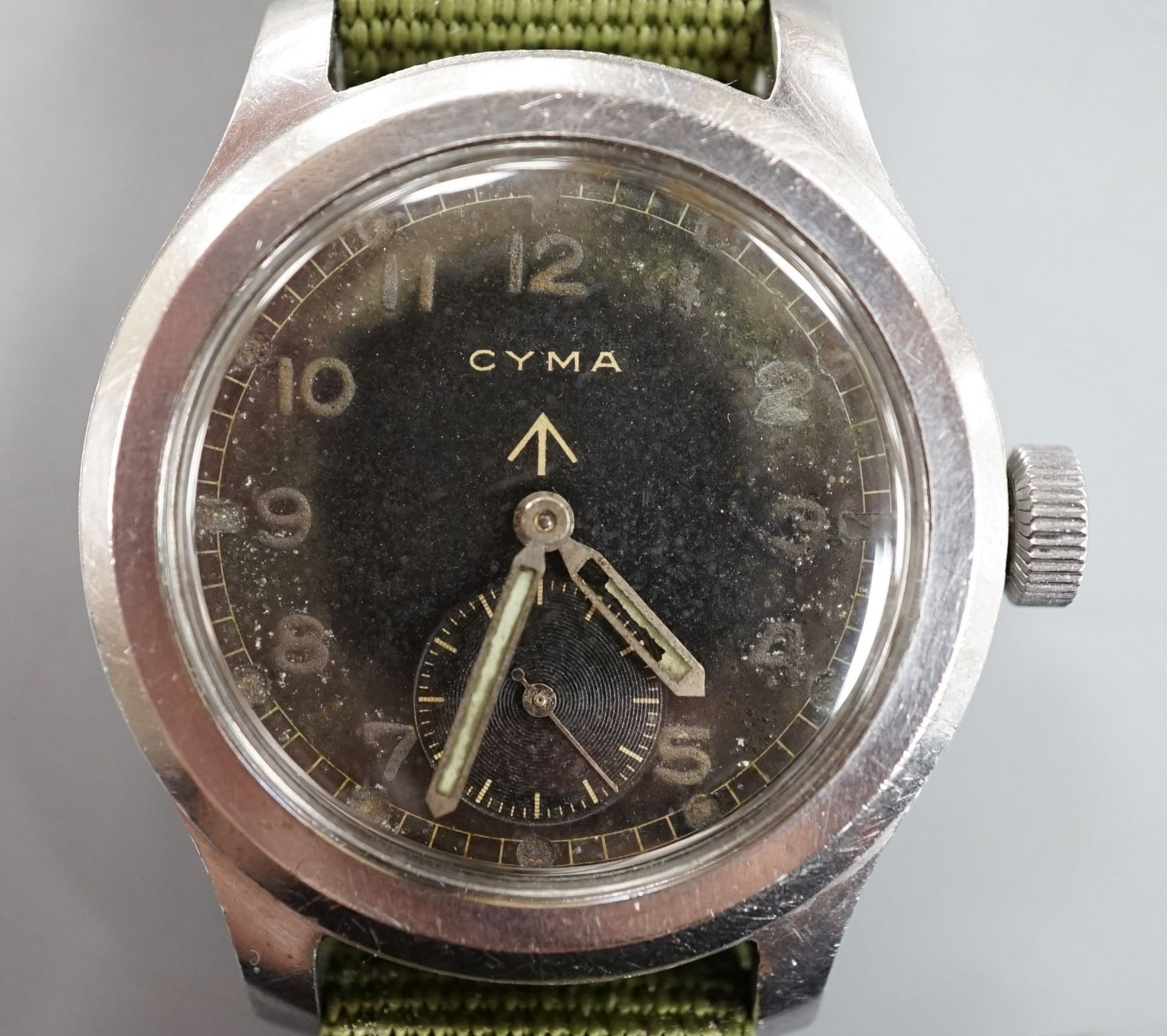 A gentleman's 1940's stainless steel Cyma British MOD military manual wind black dial wrist watch, case diameter 38mm, movement c.234, on fabric strap.